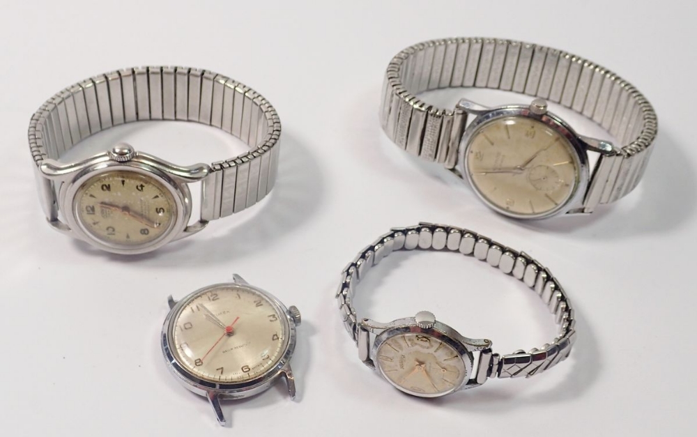 A group of four vintage mechanical watches including Roamer etc.