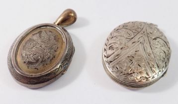 A silver oval engraved locket 4 x 3.2cm and a white metal locket engraved bird a/f