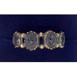 A Victorian gold ring set with carved jet beads, unmarked but tested as 15 ct gold 1.6g, size O