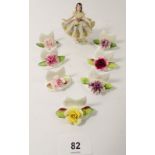 A set of seven Coalport floral table place name settings together with a small Dresden figure of a