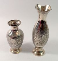Two antique Indian white metal vases with engraved decoration, tested as 85% silver content, tallest