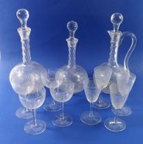 Three Victorian facet cut glass decanters, four cocktail glasses and four sherry glasses, all etched