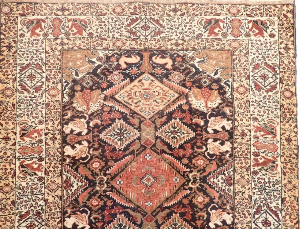 A Persian style rug with coral red and blue lozenge design, 181 x 100cm - Image 3 of 3