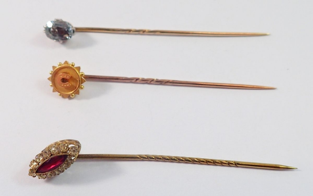 A Victorian 15 carat gold stick pin decorated horseshoe, a 9 carat gold one set aquamarine and a - Image 2 of 2