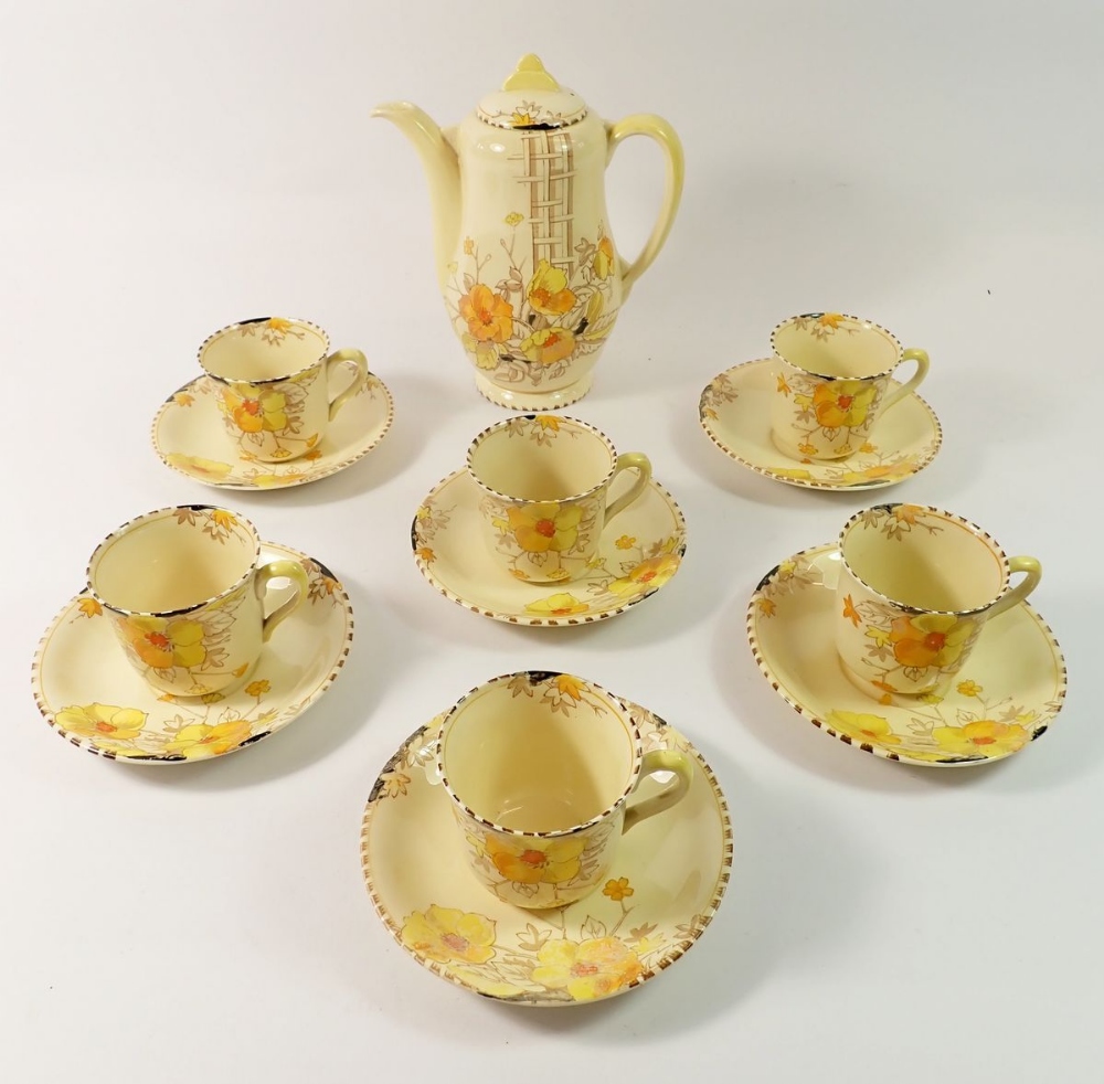 A Wilkinson's Art Deco Honeyglaze coffee set comprising coffee pot, six cups and saucers