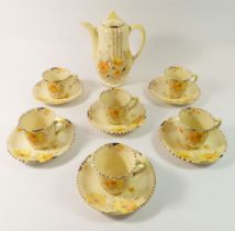 A Wilkinson's Art Deco Honeyglaze coffee set comprising coffee pot, six cups and saucers