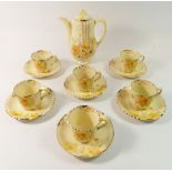 A Wilkinson's Art Deco Honeyglaze coffee set comprising coffee pot, six cups and saucers