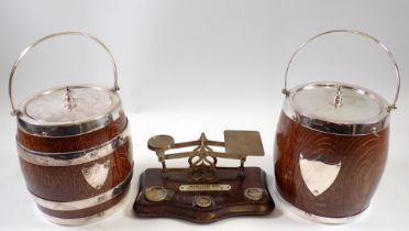 A set of Edwardian postal scales, 19cm wide and two oak and chrome biscuit barrels, 16cm tall