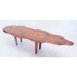 A rustic yew wood plank top live edge coffee table labelled 'Hand Made Hugo Mason", 135 x 38 x