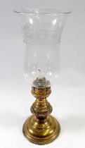 A Victorian brass candle lamp with glass shade, 38cm