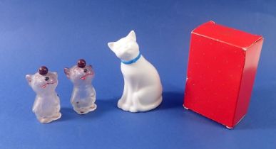 An Avon cat scent bottle boxed, 11cm tall and two pug scent bottles