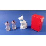 An Avon cat scent bottle boxed, 11cm tall and two pug scent bottles