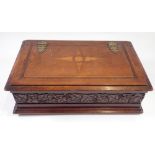 A Victorian mahogany box with star inlay and carved border, 19 x 31 x 9cm