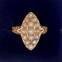 A Victorian gold mourning ring set marquise arrangement of seed pearls and inset hair locket to