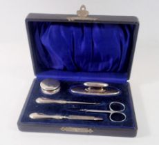 A silver manicure set boxed, Birmingham 1921 and 1923