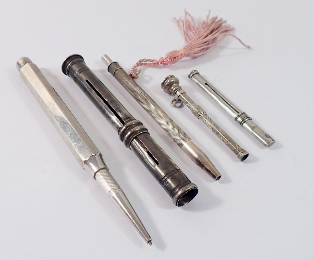 Four various silver hallmarked pencils and a silver tooth pick