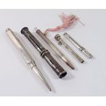 Four various silver hallmarked pencils and a silver tooth pick