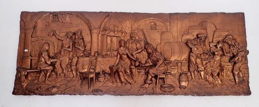 A large copper finish moulded panel depicting 17th century tavern scene, 43 x 120cm