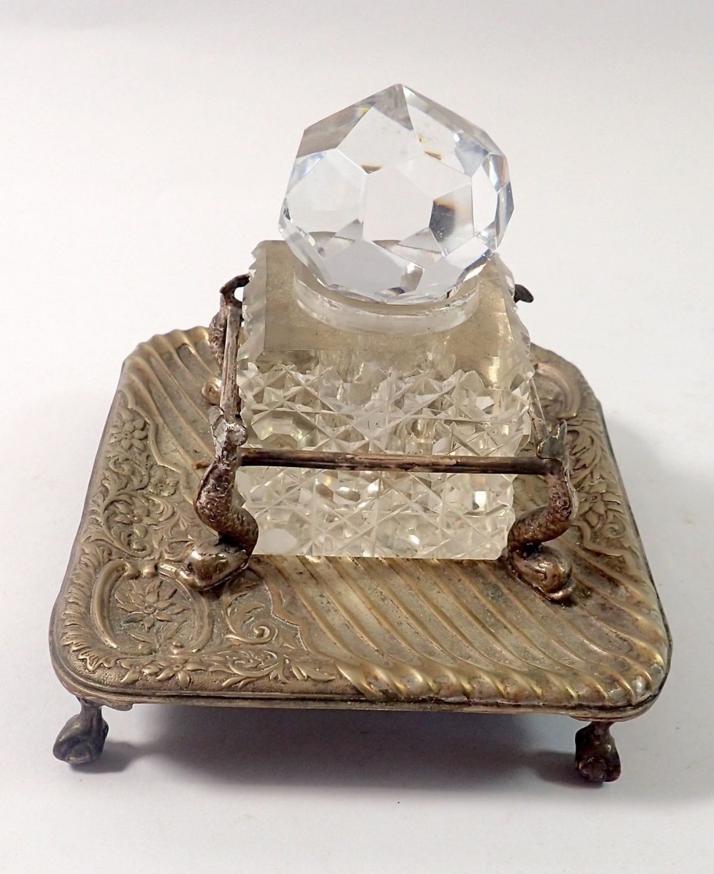 A cut glass inkwell in silver plated stand with dolphin supports, 11 x 13cm - Image 2 of 2