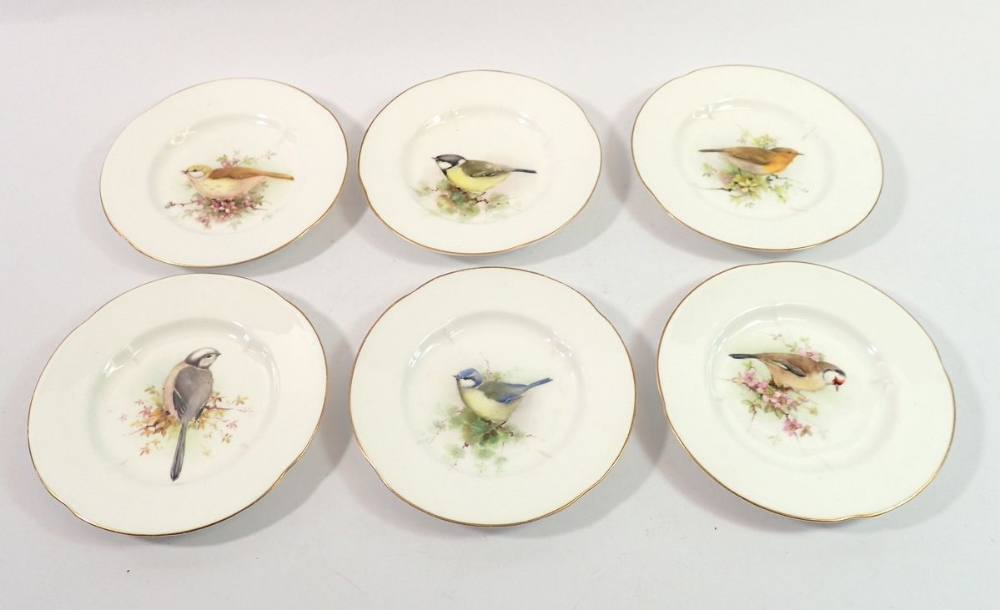 A set of six small Royal Worcester plates painted birds, 13cm diameter