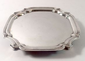 A silver card tray on four feet, London 1973, 324g, 19cm x 19cm by Wakely and Wheeler