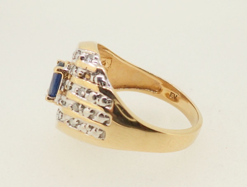 A 10k gold ring set oval cut sapphire in five diagonal rows of channel set diamonds, 5.6g, size W - Image 3 of 4