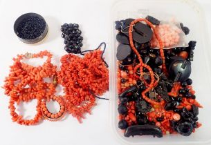 A box of antique coral necklaces and coral and jet beads