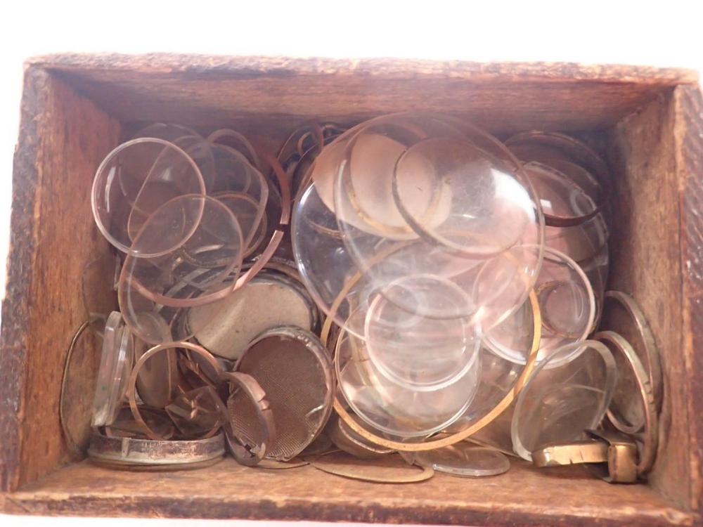 A quantity of antique watch glasses and yellow metal locket surrounds - Image 2 of 2