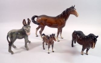 A Beswick brown mare and foal, a Beswick pony and an Italian Donkey, tallest 22cm