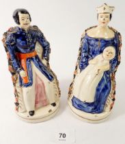 A pair of 19th century Staffordshire figures of Queen Victoria and Prince Albert seated, 17cm tall