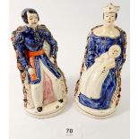 A pair of 19th century Staffordshire figures of Queen Victoria and Prince Albert seated, 17cm tall