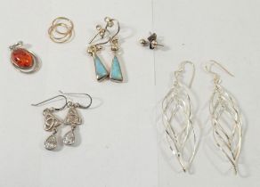 Four pairs of silver earrings, three yellow metal earring and a silver and amber pendant