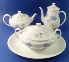 A Wedgwood Ice Rose dinner service comprising three serving platters, seven dinner plates, eight
