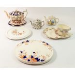 Three Edwardian teapot stands, a tea cup with integral saucer and three teapots