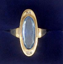 A gold ring set long oval cut blue topaz, unmarked but tested as gold, 3g, size N