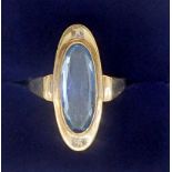 A gold ring set long oval cut blue topaz, unmarked but tested as gold, 3g, size N