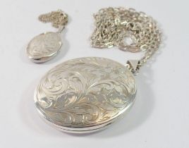 Two engraved silver lockets, largest 5.2cm and one silver chain