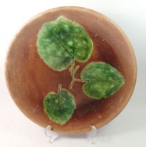 A Majolica plate decorated three leaves, Secla Portugal, 33cm diameter