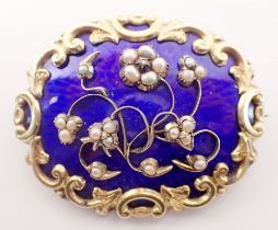 A Victorian gold and blue enamel locket brooch decorated pearl set floral design, unmarked but