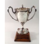 A silver three handled Art Nouveau trophy cup, 'Kingsland Grand Gymnasium Cup', engraved names,