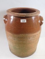 A large terracotta crock jar, 40cm tall