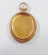 A Victorian 9 carat gold oval locket with engraved decoration and glazed to verso, 9g, 4 x 3.3cm