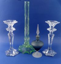 A pair of faceted glass candlesticks, 26cm tall, an Edwardian green stem vase and a frosted scent