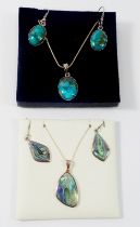 A silver and abalone pendant and earring and another stone set