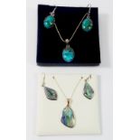 A silver and abalone pendant and earring and another stone set