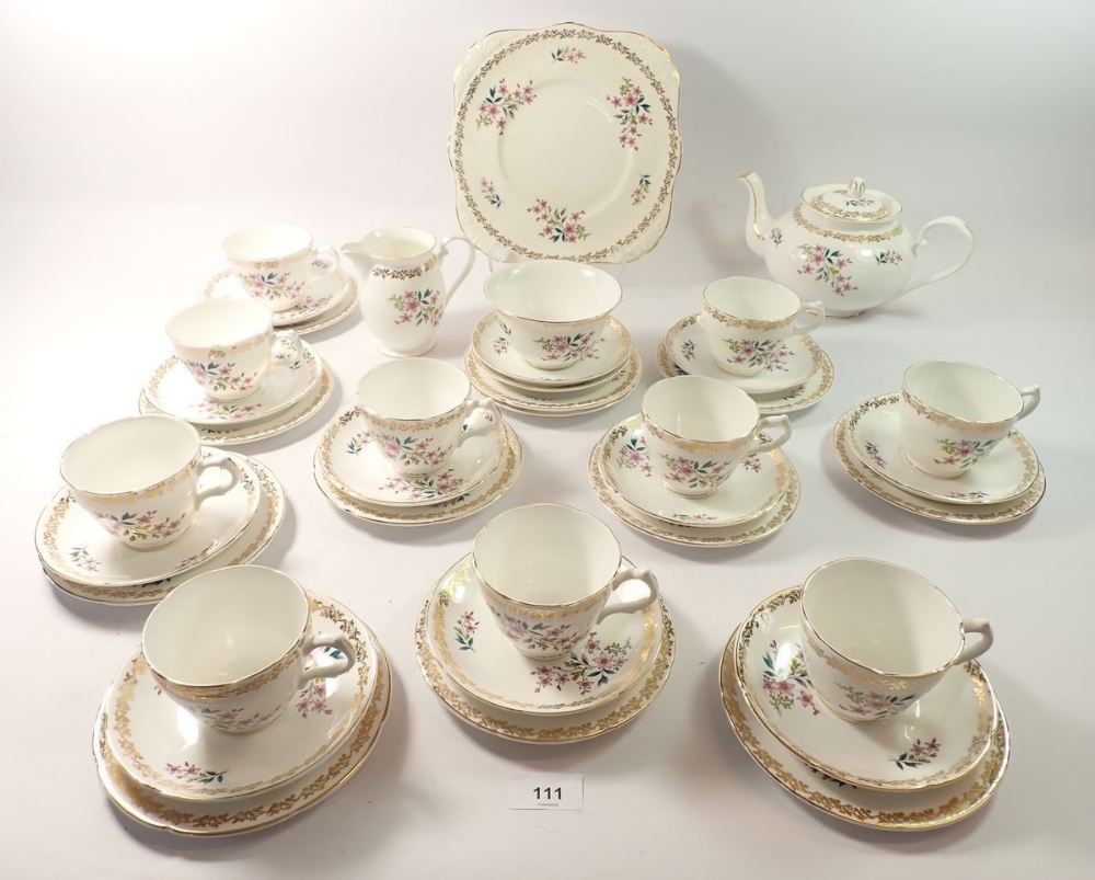 A vintage Grafton floral tea service comprising:- teapot, milk, sugar, cake plate, ten cups,