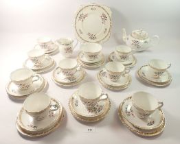 A vintage Grafton floral tea service comprising:- teapot, milk, sugar, cake plate, ten cups,
