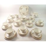 A vintage Grafton floral tea service comprising:- teapot, milk, sugar, cake plate, ten cups,