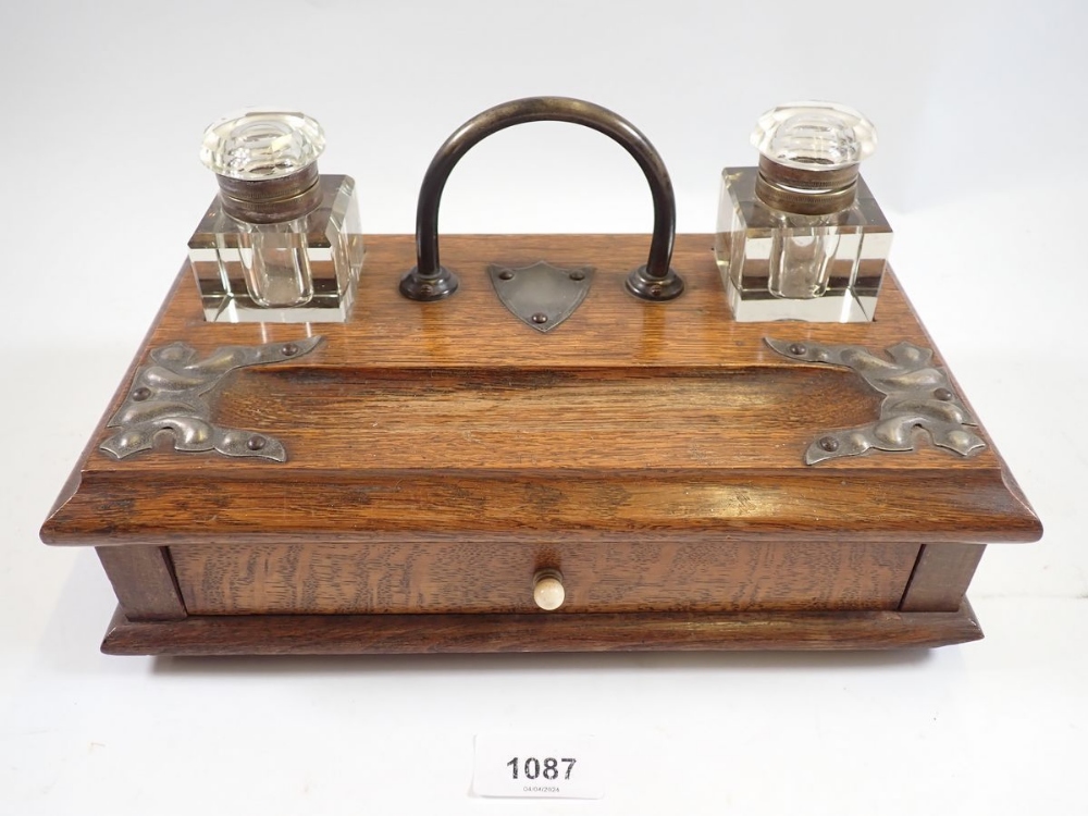 A Victorian oak desk stand with two cut glass inkwells and drawers, 28cm wide