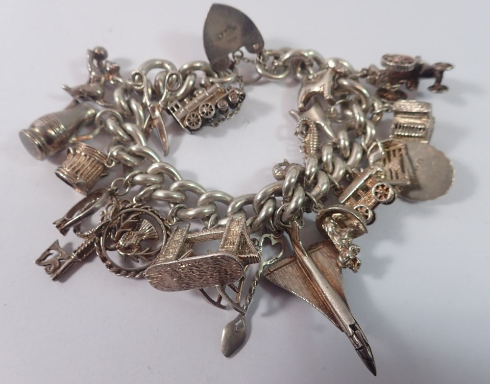 A large silver charm bracelet, 121g total weight - Image 2 of 2